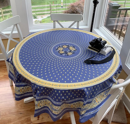 70 inches round plastic coated french tablecloth in blue and gold tones