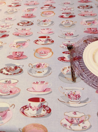 pink and grey coated tablecloth with tea cups designs