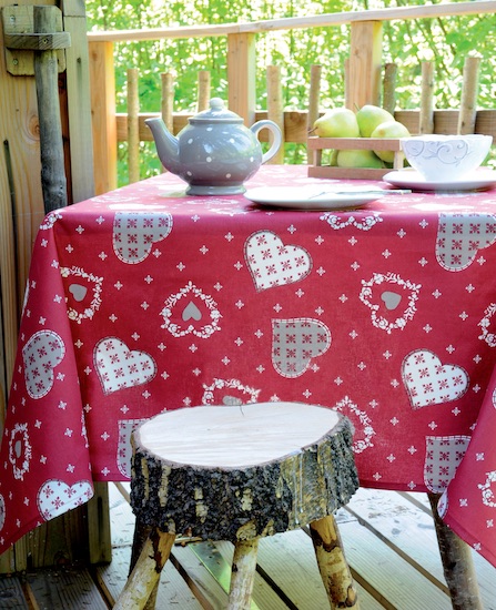 Christmas coated tablecloth with mountain hearts designs in red