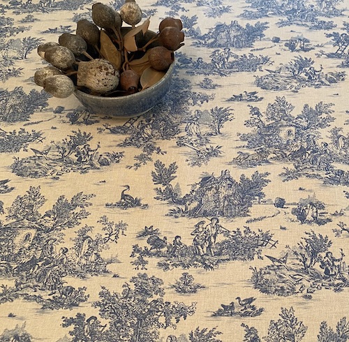 blue and white toile coated tablecloth