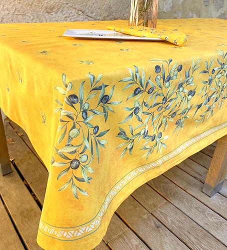 provencal tablecloth with olive designs on a yellow background